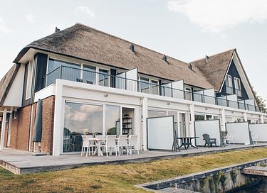 Thatched villa with lake view