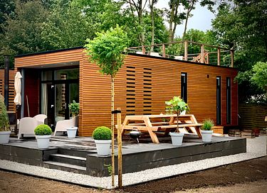 Water house with roof terrace and lake view