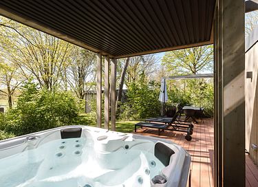 Lodge with an outdoor hot tub and a view - 2
