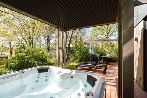 Lodge with an outdoor hot tub and a view - 2