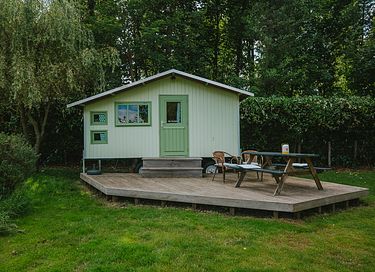 Colorful cottage on wheels at campsite - 2
