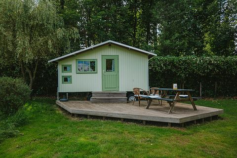 Colorful cottage on wheels at campsite - 2