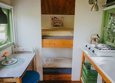 Colorful cottage on wheels at campsite - 5
