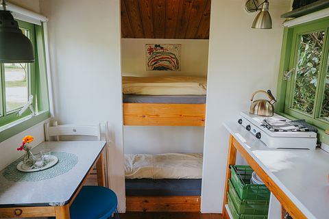 Colorful cottage on wheels at campsite - 5