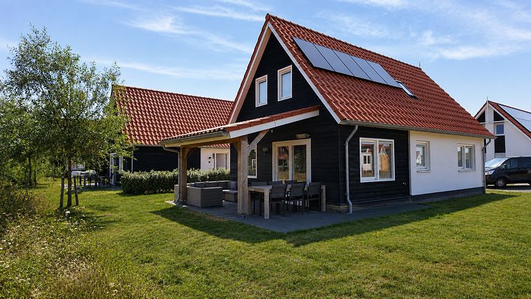Holiday home with a covered porch in Zeeland - 1
