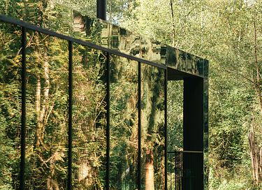 Mirror forest lodge by a stream - 17