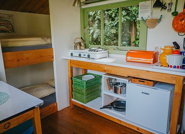 Colorful cottage on wheels at campsite - 4