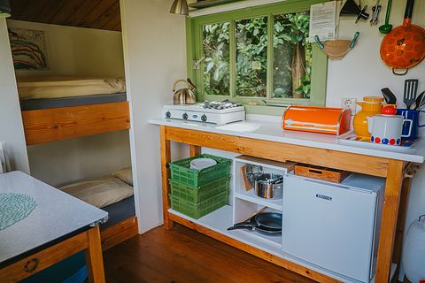 Colorful cottage on wheels at campsite - 4