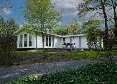 Maison de vacances dans un parc avec étang