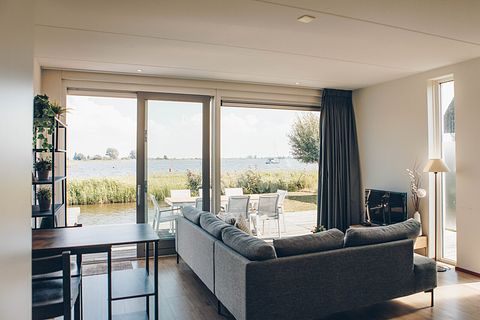 Rietgedekte villa met uitzicht over het meer - 5