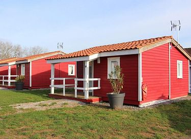 Colorful chalet in a wooded area