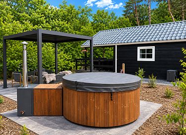 Cozy lodge with a porch and hot tub in Drenthe
