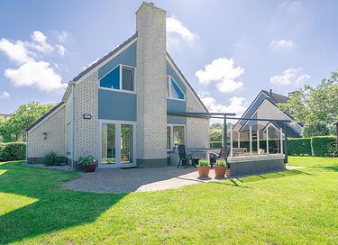 Holiday home with garden close to the sea