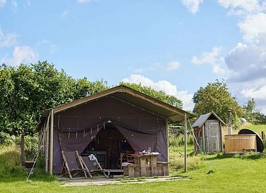 Tent cabin with private shower and hot tub