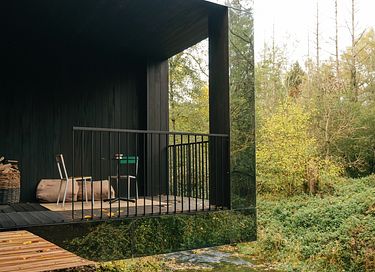 Mirror forest lodge by a stream - 16