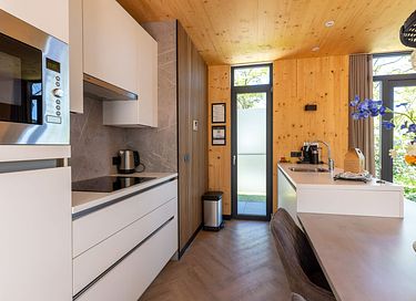 Lodge with an outdoor hot tub and a view - 11