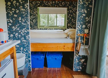 Colorful cottage on wheels at campsite - 6