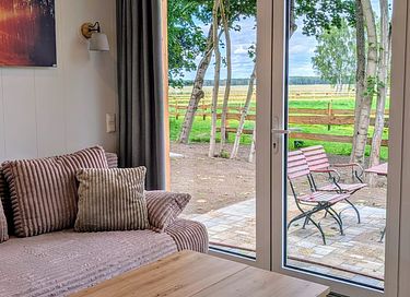 Gemütliches Tiny House mit Blick auf Alpakas