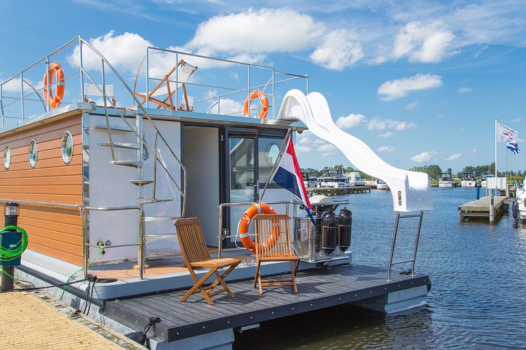 Stay on a luxury houseboat with a slide - 1