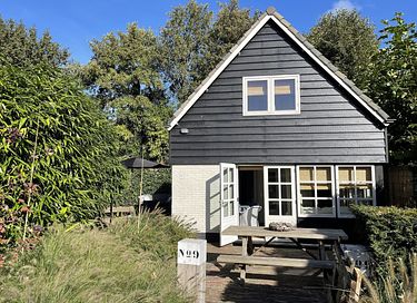 Detached cottage near forest and sea